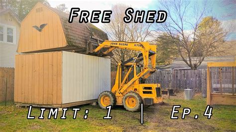 moving shed with skid steer|moving storage shed on skids.